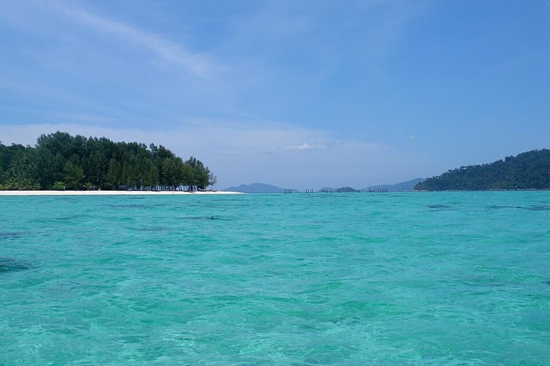 Turquoise lagoon water off a sandy spit on Koh Lipe